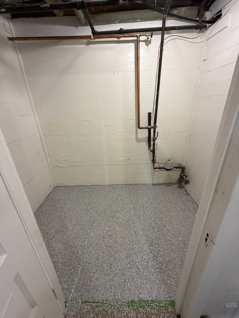 Basement utility room · sealed flake floor — after coating