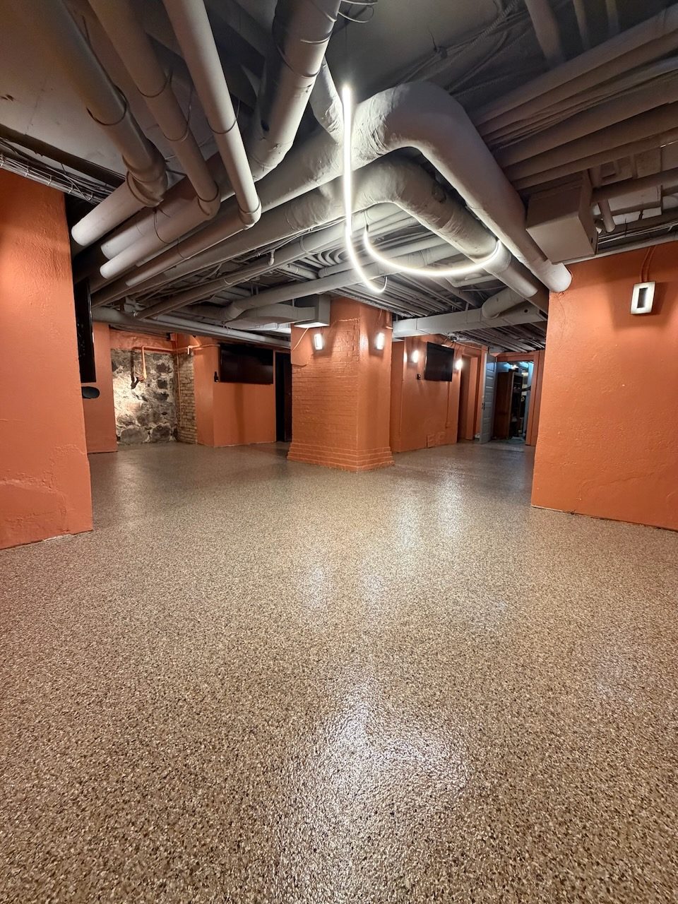 Commercial corridor · bare slab to vinyl chip — after coating