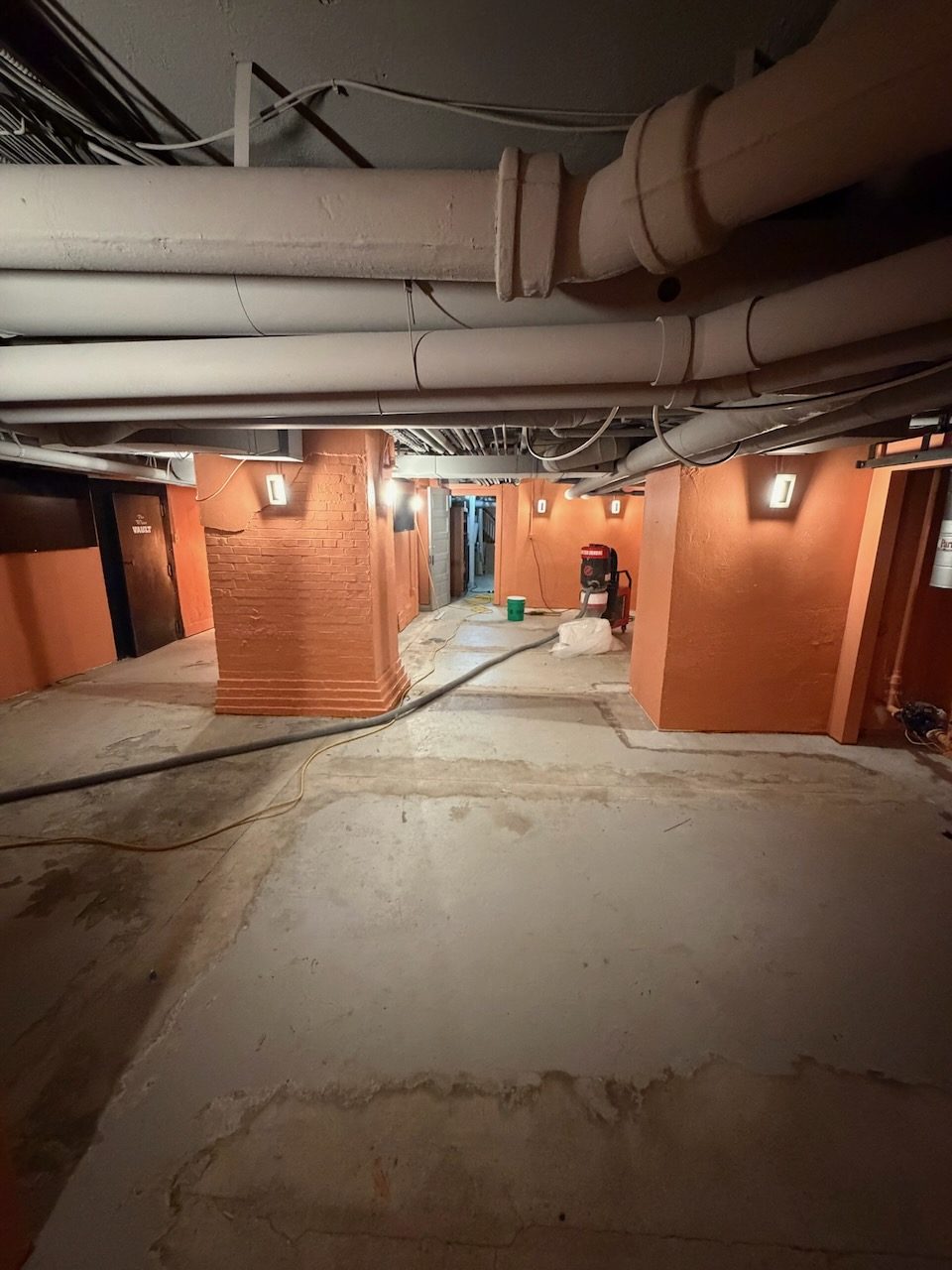 Commercial corridor · bare slab to vinyl chip — before coating