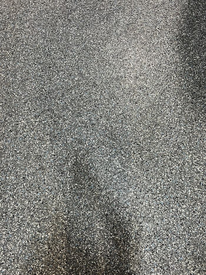 Flake detail · charcoal blend — Signature Finishes concrete coating
