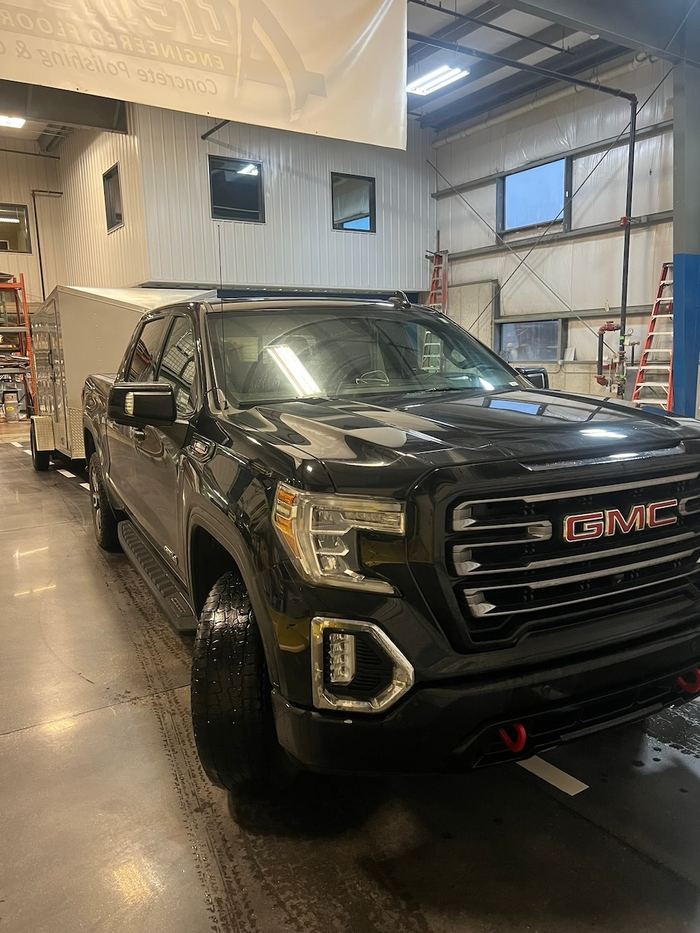 Showroom garage · daily driver ready — Signature Finishes concrete coating