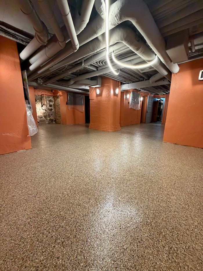 Commercial corridor · vinyl chip — Signature Finishes concrete coating