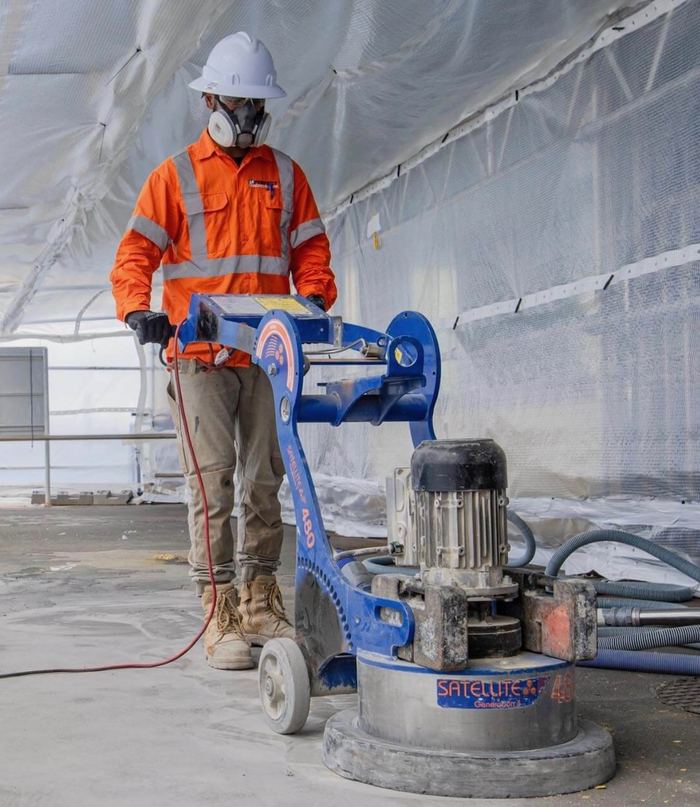 Diamond grinding the slab — Signature Finishes concrete coating