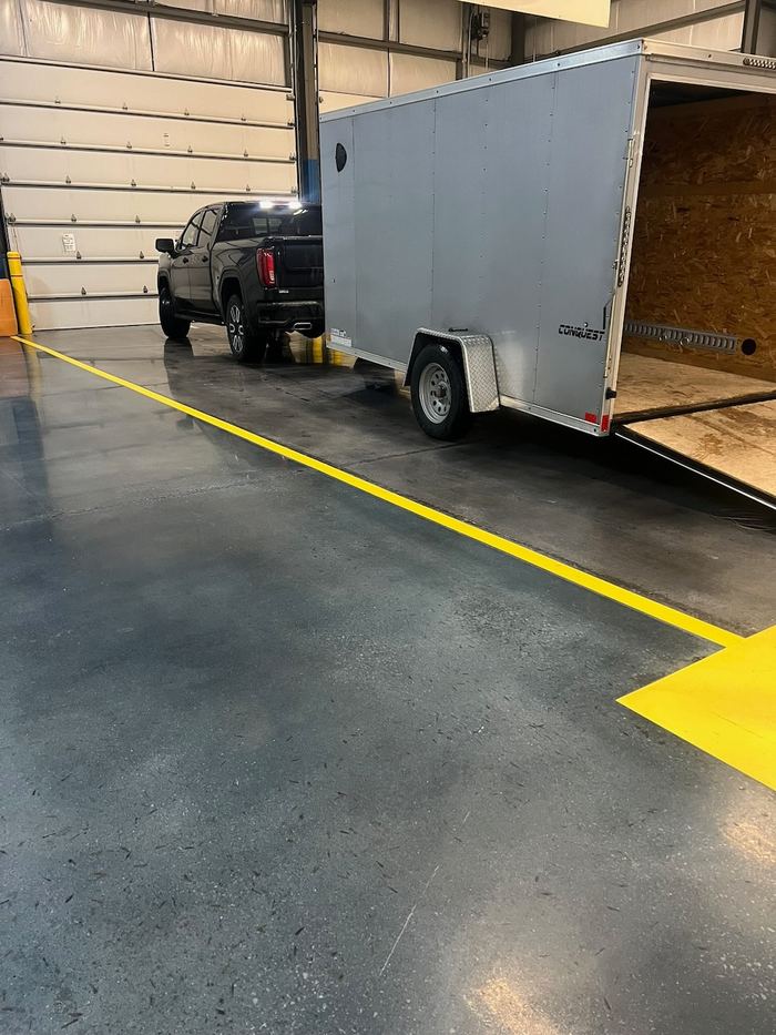 Shop floor · safety striping — Signature Finishes concrete coating