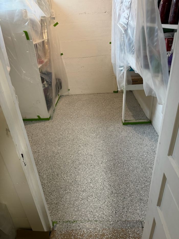 Storage room · light flake — Signature Finishes concrete coating