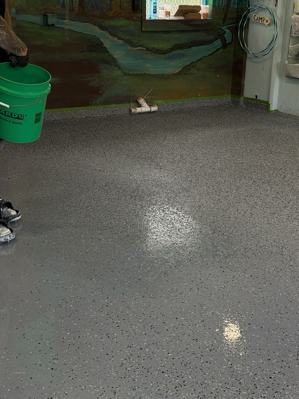 Decorative vinyl chip floor close-up &mdash; multi-tone flake on a finished basement floor